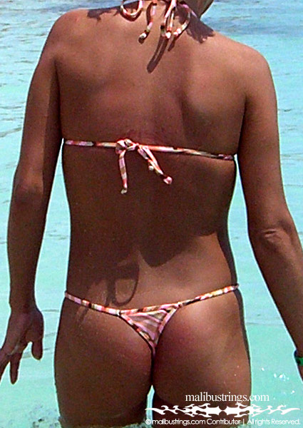 Kim K in a Malibu Strings bikini in Cancun.