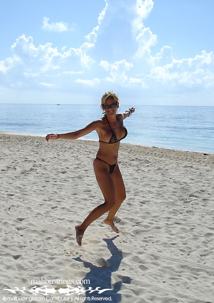 Sophie in a Malibu Strings bikini on Playa del Carmen, Mexico.
