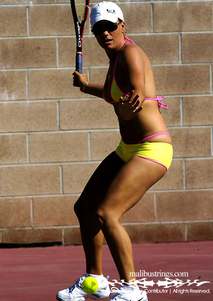 Natasha playing tennis in a Malibu Strings bikini in Palm Springs, California.